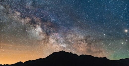 mountain range under milky way